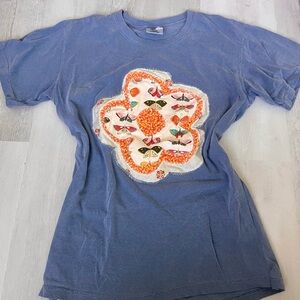 Blue T-Shirt with Colorful Flower Design